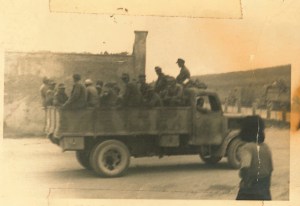 "German prisoners. I am sitting in the front." Written on the back.