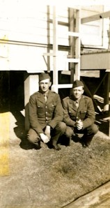 Written on the back of the picture "Ray and myself. These hats we have on are our oversees caps.