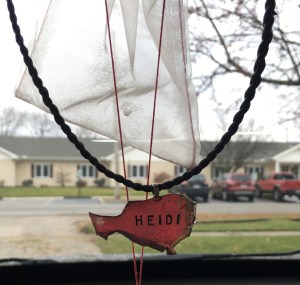 This is a necklace of Niger...our Nigerien brothers had our names engraved on them. I have it hanging in my car so when I drive, I always pray for Niger.