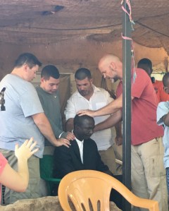 Praying over the men at Zachary's house.